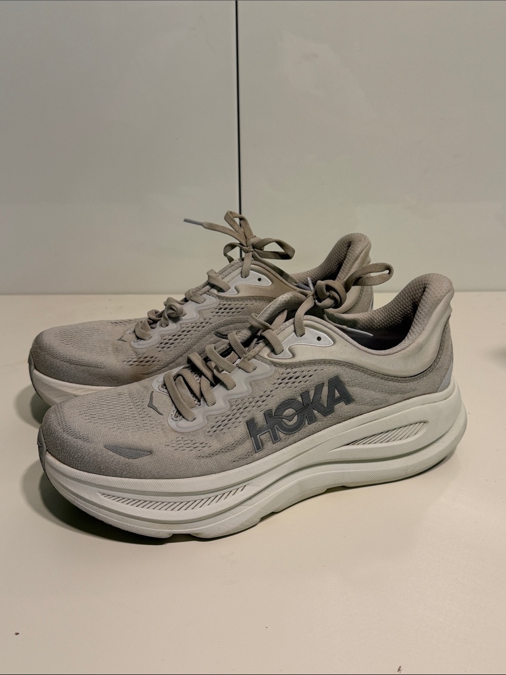 Gently used Hoka Neutral Running Shoes in Light Gray and White womens 11 B